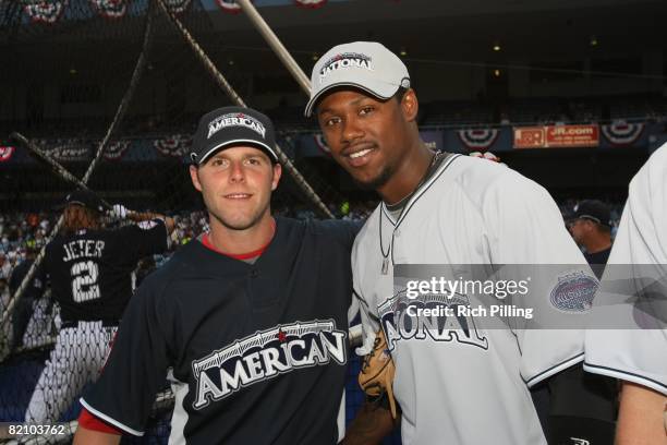 Dustin Pedroia of the Boston Red Sox poses with Hanley Ramirez of the Florida Marlins before the State Farm Home Run Derby at the Yankee Stadium in...