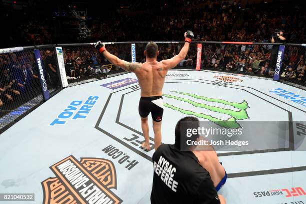 Chris Weidman celebrates after submitting Kelvin Gastelum in their middleweight bout during the UFC Fight Night event inside the Nassau Veterans...