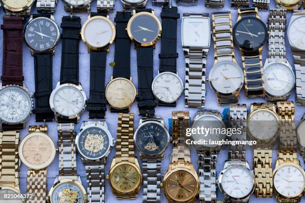 fake counterfeit wristwatch bangkok thailand - designer label stock pictures, royalty-free photos & images