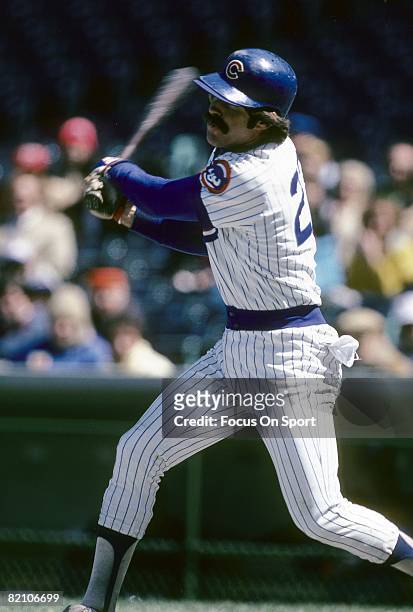 S: First Baseman Bill Buckner of the Chicago Cubs swings and watches the flight of his ball during a late circa 1970's Major League Baseball game at...