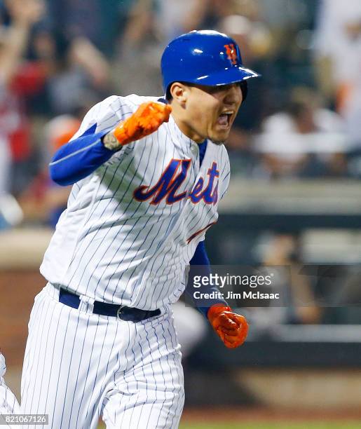 Wilmer Flores of the New York Mets reacts after his ninth inning game winning home run against the Oakland Athletics at Citi Field on July 22, 2017...