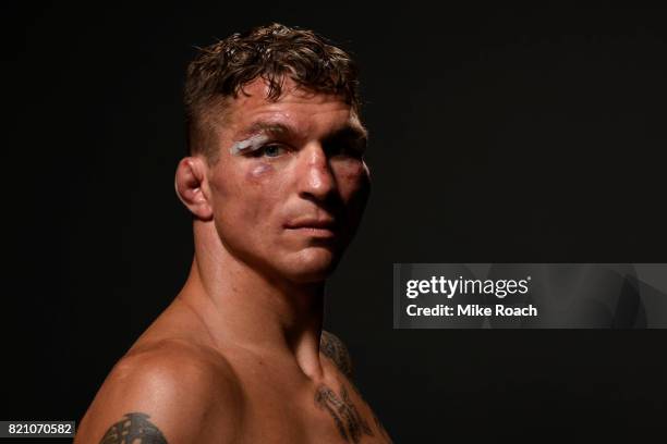 Darren Elkins poses for a post fight portrait backstage during the UFC Fight Night event inside the Nassau Veterans Memorial Coliseum on July 22,...