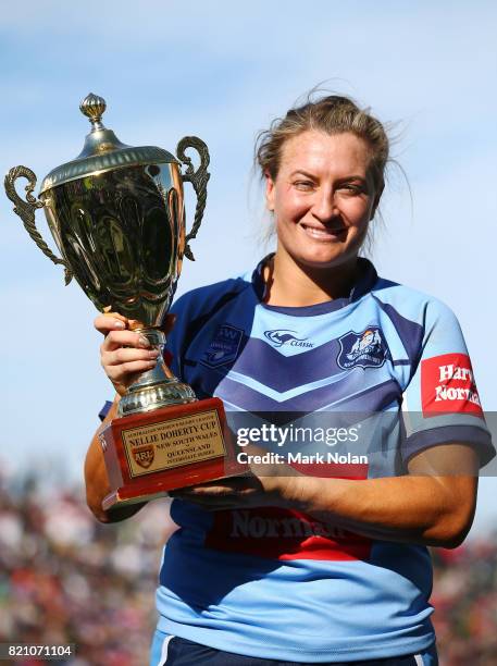 Ruan Sims of NSW is pictured with the trophy after winning the Women's Interstate Challenge match between New South Wales and Queensland at WIN...