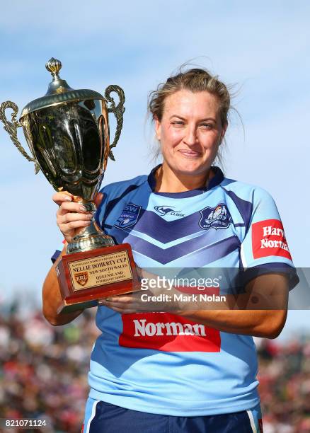Ruan Sims of NSW is pictured with the trophy after winning the Women's Interstate Challenge match between New South Wales and Queensland at WIN...