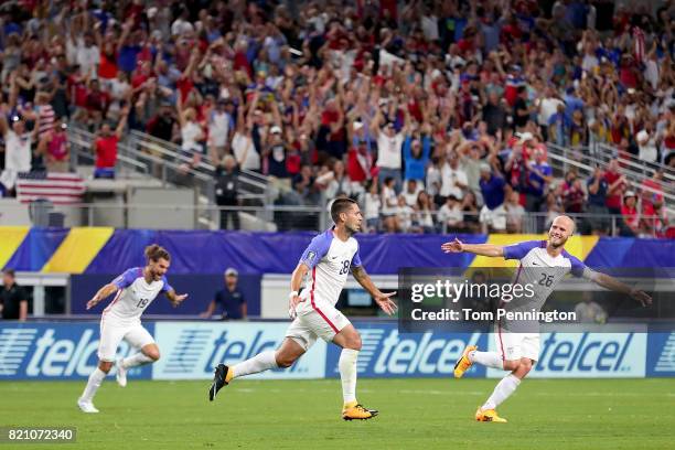 Clint Dempsey of United States celebrates with Graham Zusi of United States and Michael Bradley of United States after scoring against Costa Rica...