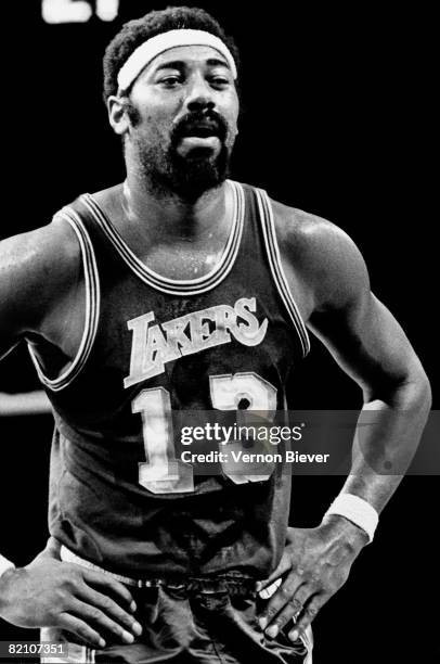Wilt Chamberlain of the Los Angeles Lakers looks on during a game against the Milwaukee Bucks during the 1970 season at the MECCA Arena in Milwaukee,...