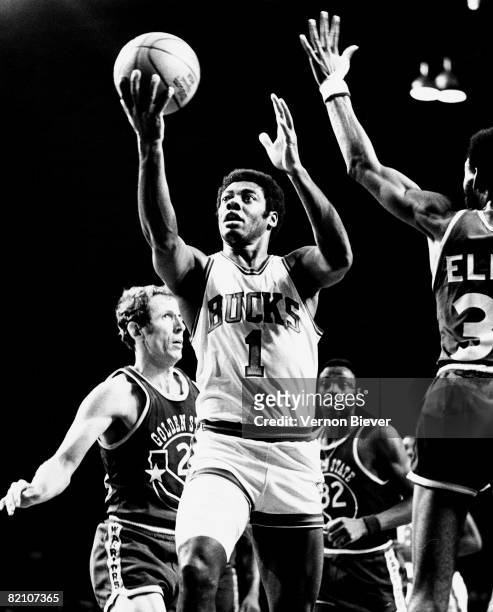 Oscar Robertson of the Milwaukee Bucks shoots a layup against the Golden State Warriors during the 1970 season at the MECCA Arena in Milwaukee,...