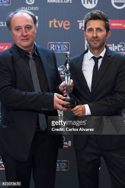 Farruco Castroman and Carlos Suarez receive the 'Best Animation Film' award for the movie 'Psiconautas, Los Ninos Olvidados' during the 'Platino...