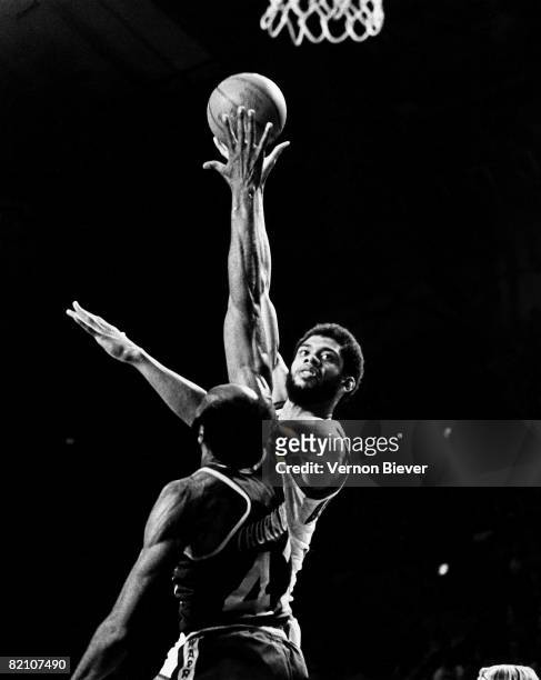 Kareem Abdul Jabbar of the Los Angeles Lakers shoots against Nate Thurmond of Buffalo Braves during the 1970 season at the MECCA Arena in Milwaukee,...