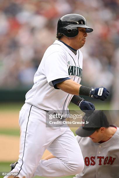 Jose Vidro of the Seattle Mariners rounds first base during their MLB game against the Boston Red Sox on July 23, 2008 at Safeco Field in Seattle,...