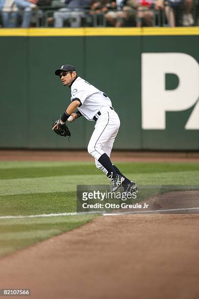 Ichiro Suzuki of the Seattle Mariners sets up to make a throw from the outfield during their MLB game against the Boston Red Sox on July 23, 2008 at...