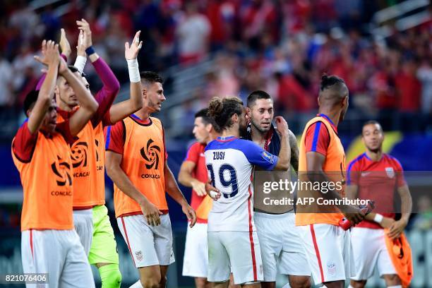 Members of United State's team celebrate after the Costa Rica vs. United States CONCACAF Gold Cup semi final match July 22, 2017 in Arlington, Texas....