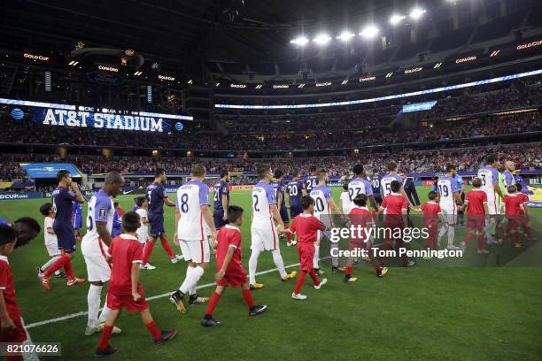 The United States and Costa Rica parade onto the pitch prior to the 2017 CONCACAF Gold Cup Semifinal at AT&T Stadium on July 22, 2017 in Arlington,...