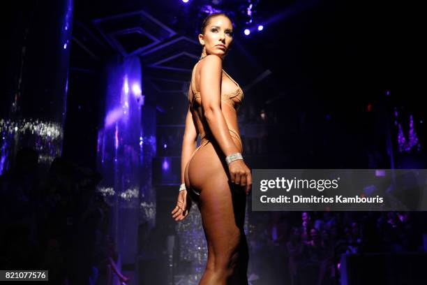 Model walks the runway at the SWIMMIAMI Minimale Animale 2018 Collection fashion show at Ora Nightclub on July 22, 2017 in Miami Beach, Florida.