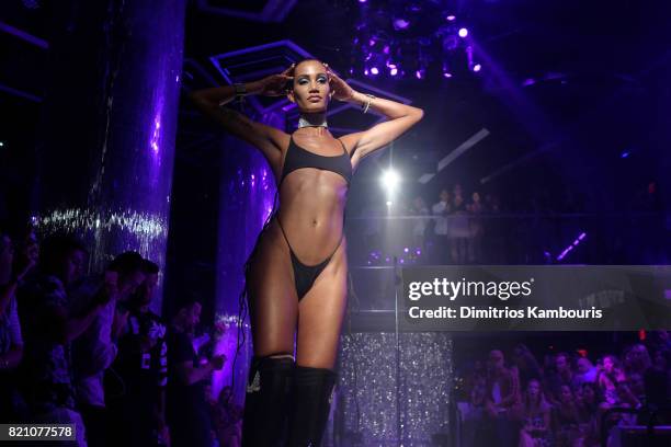 Model walks the runway at the SWIMMIAMI Minimale Animale 2018 Collection fashion show at Ora Nightclub on July 22, 2017 in Miami Beach, Florida.