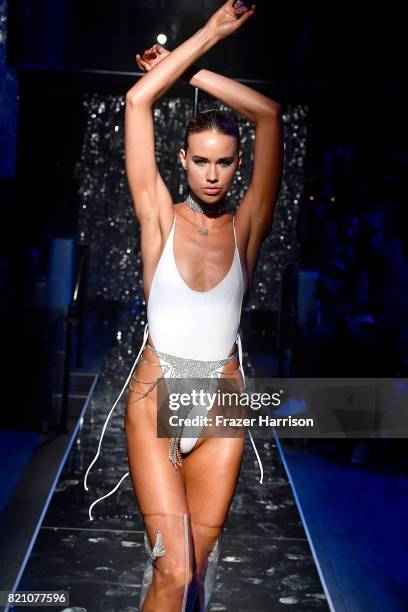 Model walks the runway at the SWIMMIAMI Minimale Animale 2018 Collection fashion show at Ora Nightclub on July 22, 2017 in Miami Beach, Florida.