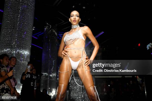 Model walks the runway at the SWIMMIAMI Minimale Animale 2018 Collection fashion show at Ora Nightclub on July 22, 2017 in Miami Beach, Florida.