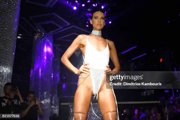 Model walks the runway at the SWIMMIAMI Minimale Animale 2018 Collection fashion show at Ora Nightclub on July 22, 2017 in Miami Beach, Florida.