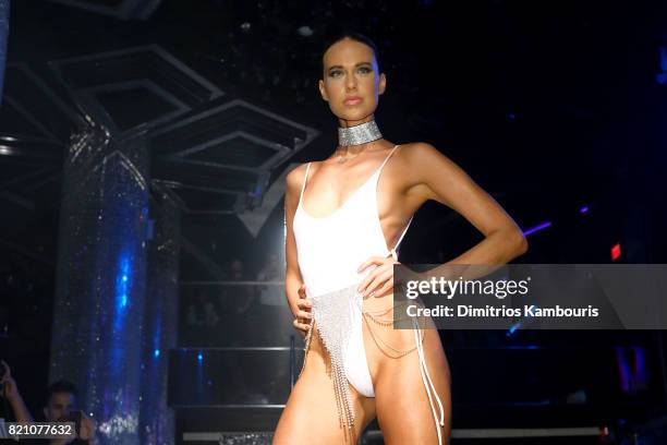 Model walks the runway at the SWIMMIAMI Minimale Animale 2018 Collection fashion show at Ora Nightclub on July 22, 2017 in Miami Beach, Florida.