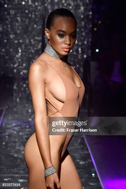 Model walks the runway at the SWIMMIAMI Minimale Animale 2018 Collection fashion show at Ora Nightclub on July 22, 2017 in Miami Beach, Florida.