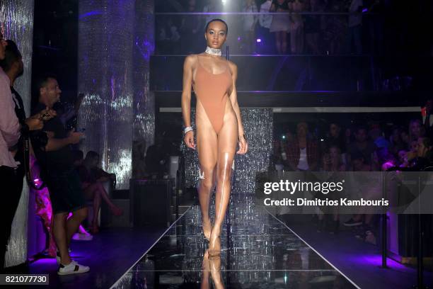 Model walks the runway at the SWIMMIAMI Minimale Animale 2018 Collection fashion show at Ora Nightclub on July 22, 2017 in Miami Beach, Florida.