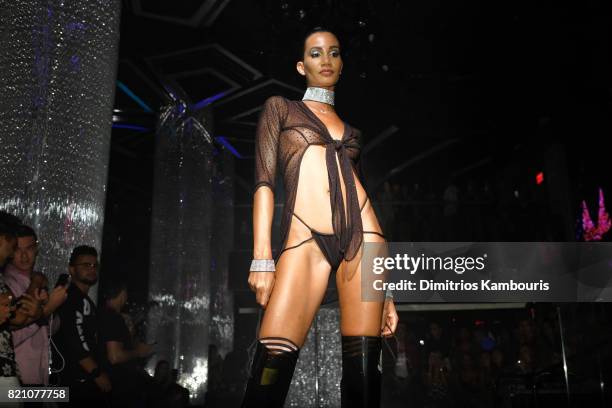 Model walks the runway at the SWIMMIAMI Minimale Animale 2018 Collection fashion show at Ora Nightclub on July 22, 2017 in Miami Beach, Florida.