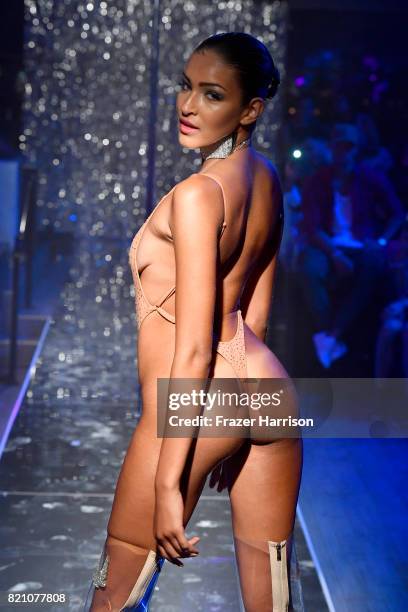 Model walks the runway at the SWIMMIAMI Minimale Animale 2018 Collection fashion show at Ora Nightclub on July 22, 2017 in Miami Beach, Florida.