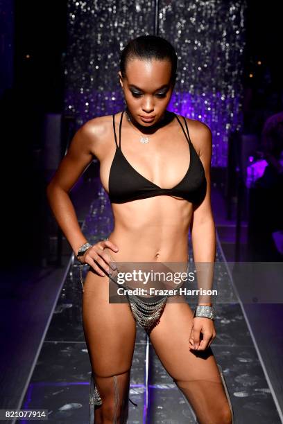 Model walks the runway at the SWIMMIAMI Minimale Animale 2018 Collection fashion show at Ora Nightclub on July 22, 2017 in Miami Beach, Florida.