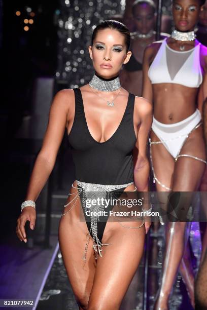 Model walks the runway at the SWIMMIAMI Minimale Animale 2018 Collection fashion show at Ora Nightclub on July 22, 2017 in Miami Beach, Florida.