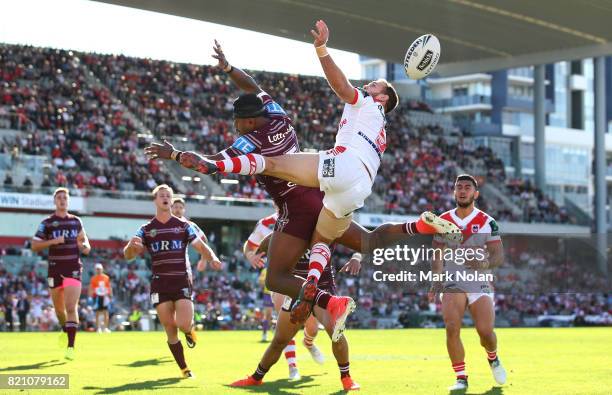 Akuila Uate of the Eagles and Jason Nightingale of the Dragons contest a high ball during the round 20 NRL match between the St George Illawarra...