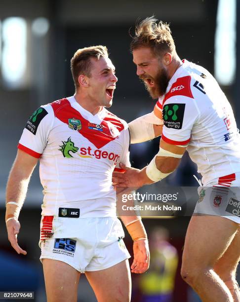 Jacob Host of the Dragons celebrates with team mate Jack De Belin after scoring during the round 20 NRL match between the St George Illawarra Dragons...