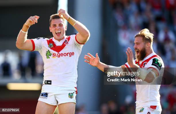 Jacob Host of the Dragons celebrates with team mate Jack De Belin after scoring during the round 20 NRL match between the St George Illawarra Dragons...