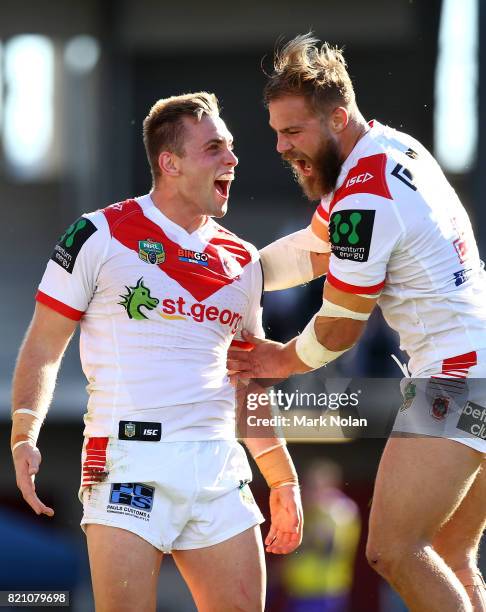 Jacob Host of the Dragons celebrates with team mate Jack De Belin after scoring during the round 20 NRL match between the St George Illawarra Dragons...