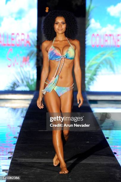 Model walks the runway at the Courtney Allegra fashion show during the Art Hearts Fashion at Miami Swim Week at SLS Hyde Beach on July 22, 2017 in...