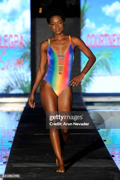 Model walks the runway at the Courtney Allegra fashion show during the Art Hearts Fashion at Miami Swim Week at SLS Hyde Beach on July 22, 2017 in...