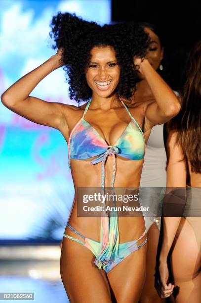 Model walks the runway at the Courtney Allegra fashion show during the Art Hearts Fashion at Miami Swim Week at SLS Hyde Beach on July 22, 2017 in...