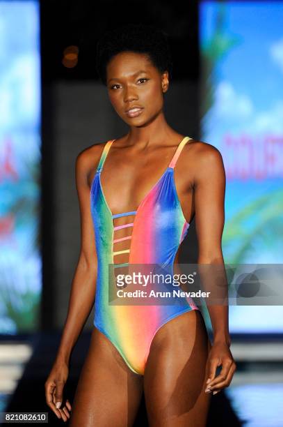 Model walks the runway at the Courtney Allegra fashion show during the Art Hearts Fashion at Miami Swim Week at SLS Hyde Beach on July 22, 2017 in...