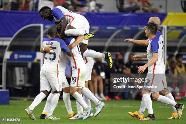 Arlington, TX United States forward Clint Dempsey celebrates with teammates after scoring a goal in the second half during a CONCACAF Gold Cup...