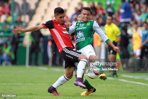 Jose Maduena of Atlas and Osvaldo Rodriguez of Leon fight for the ball during the 1st round match between Leon and Atlas as part of the Torneo...