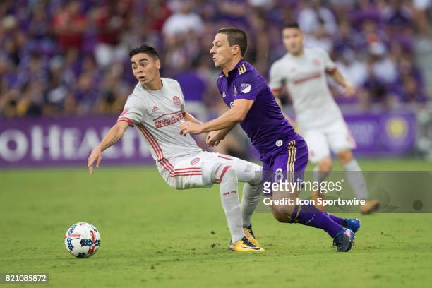 Orlando City SC forward Will Johnson and Atlanta United midfielder Miguel Almiron collide during the MLS soccer match between Atlanta United FC and...