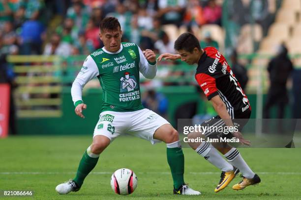 Juan Cornejo of Leon and Brayan Garnica of Atlas fight for the ball during the 1st round match between Leon and Atlas as part of the Torneo Apertura...