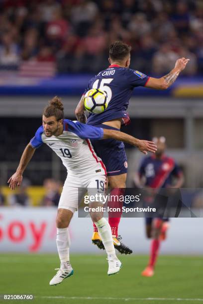 United States defender Graham Zusi and Costa Rica defender Francisco Calvo go up for a header during the CONCACAF Gold Cup Semifnal game between USA...