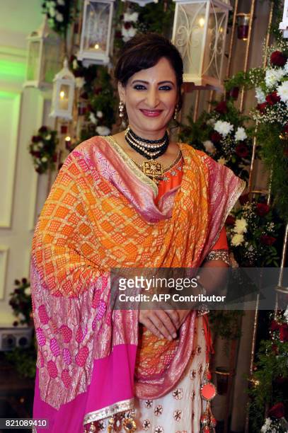 In this photograph taken on July 22, 2017 Indian Bollywood actress Rkshanda Khan poses for a picture at the Ghazal music festival 'Khazana' to raise...