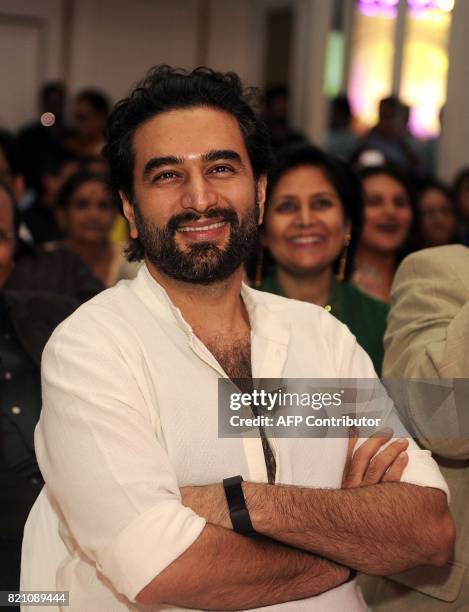 In this photograph taken on July 22, 2017 Indian Bollywood music director Shekhar Ravjiani looks on at the Ghazal music festival 'Khazana' to raise...