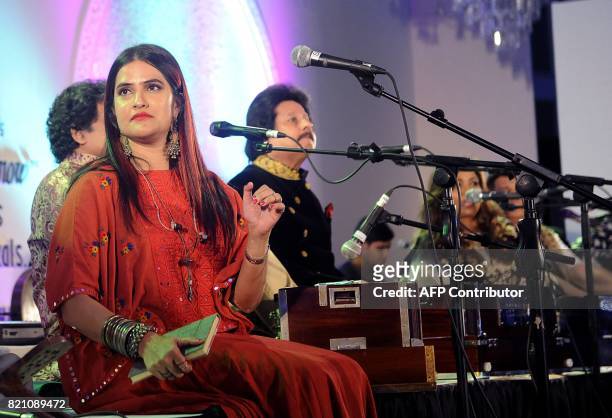 In this photograph taken on July 22, 2017 Indian Bollywood singer Sona Mohapatra attends the Ghazal music festival 'Khazana' to raise funds for...