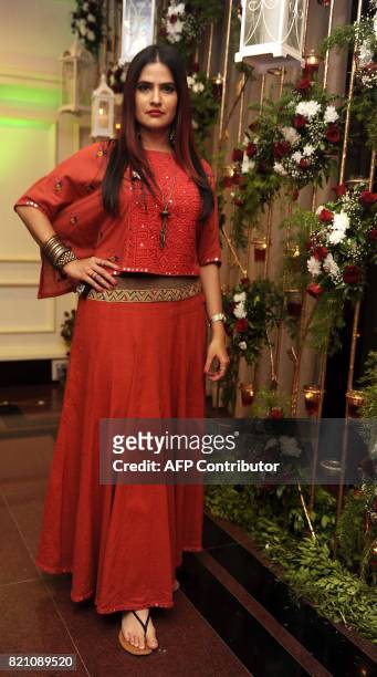 In this photograph taken on July 22, 2017 Indian Bollywood singer Sona Mohapatra pose for a picture at the Ghazal music festival 'Khazana' to raise...