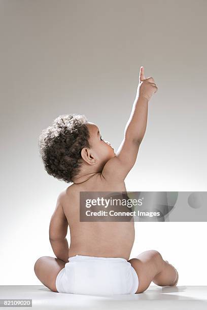 a baby boy pointing - cute baby stock pictures, royalty-free photos & images