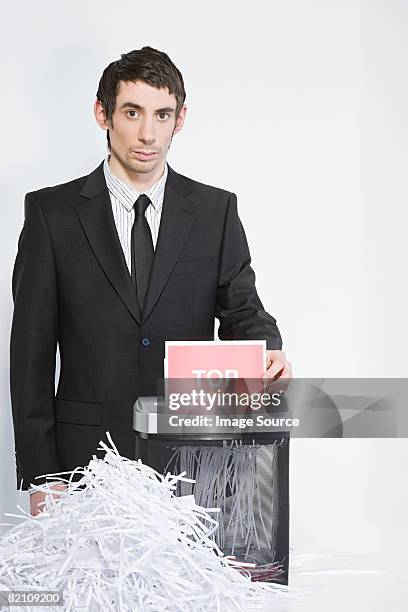 man shredding paper - paper shredder on white stock pictures, royalty-free photos & images