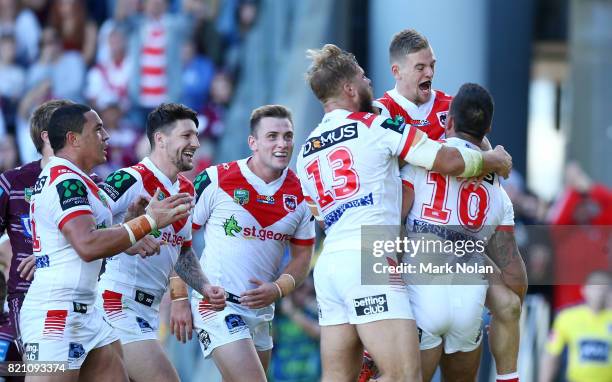 Paul Vaughan of the Dragons celebrates his try with team amtes during the round 20 NRL match between the St George Illawarra Dragons and the Manly...