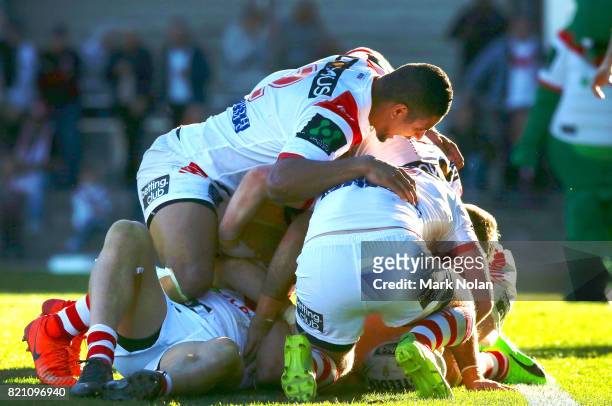 Dragons players celebrate a try by Euan Aitken during the round 20 NRL match between the St George Illawarra Dragons and the Manly Sea Eagles at WIN...